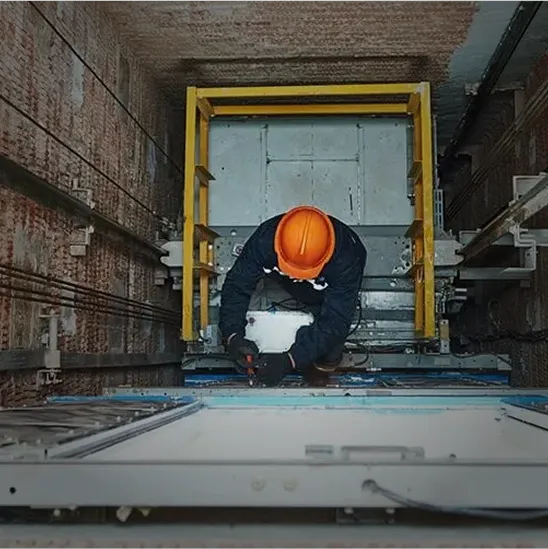 elevator technicians performing service and inspection
